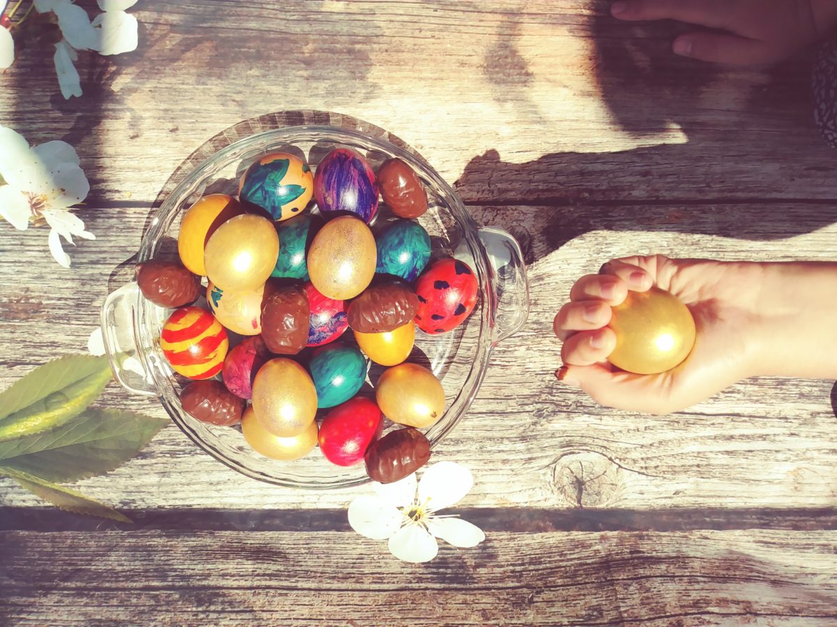 child holding golden easter egg